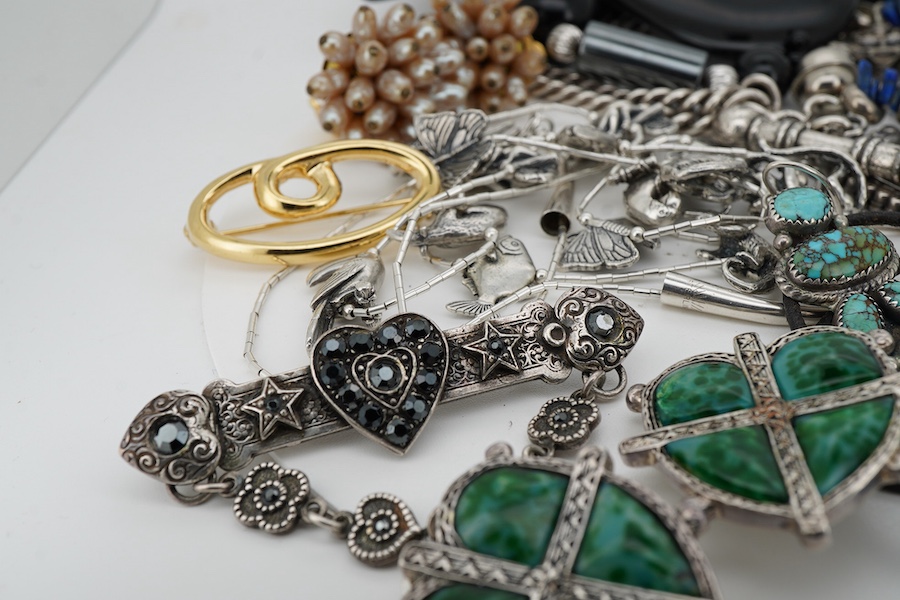 A small quantity of assorted silver and costume jewellery, including a French drop brooch and necklace by Zoe Coste, a rough cut opal set necklace and a pair of silver and turquoise drop earrings by Ron Wesley